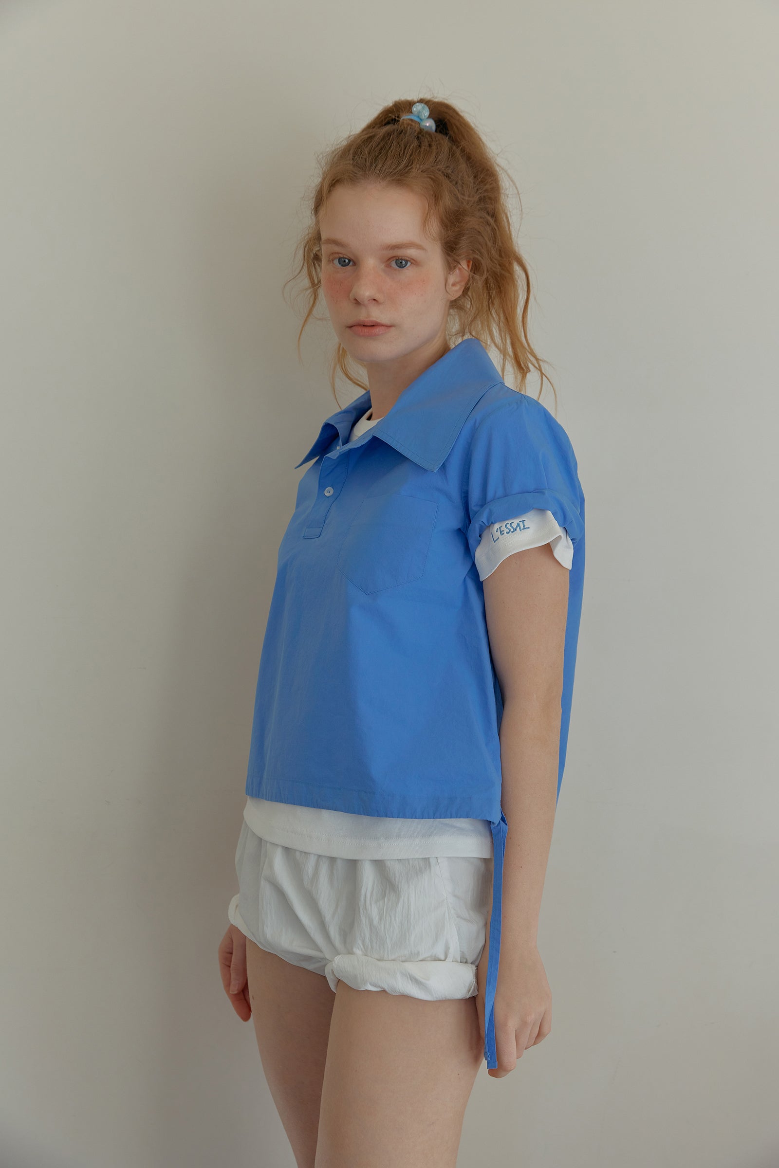 ASYMMETRY COLLAR POLO CROP SHIRT_BLUE